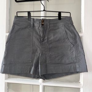 High waisted grey shorts with turquoise buttons